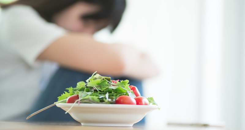 神経性食欲不振の原因は何ですか?